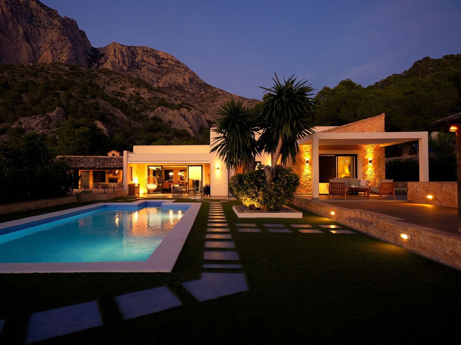 A warm, welcoming home at dusk — the kind of place Gene helps borrowers finance.